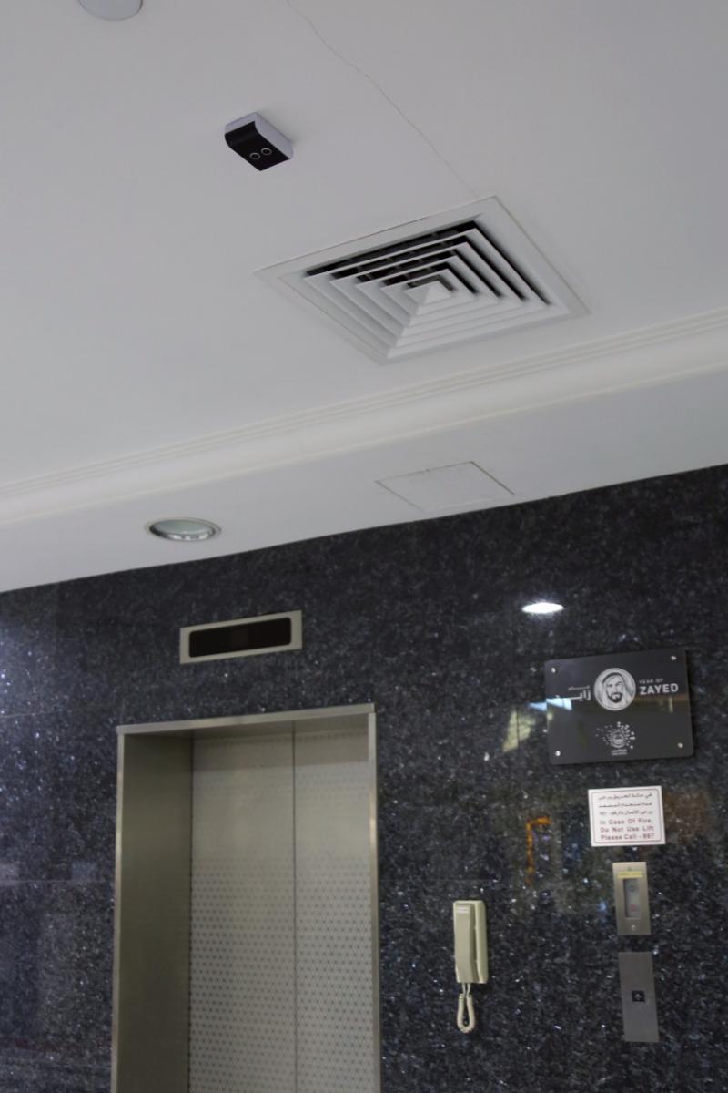 Navigation sensor installed on the ceiling next to an elevator door